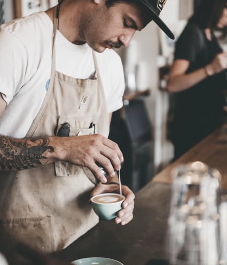 man pouring coffee